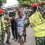 Members of the Nigerian Army Military Police detain a man suspected of smoking illegal substances during a rally for the All Progressives Congress (APC) presidential candidate Bola Ahmed Tinubu at Teslim Balogun Stadium in Lagos on February 21, 2023 ahead of the Nigerian presidential election. (Photo by Michele Spatari / AFP)