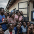 A crowd of Malawians watching a screen showing preliminary election results.