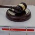 A gavel on top of legal documents, representing a court ruling.