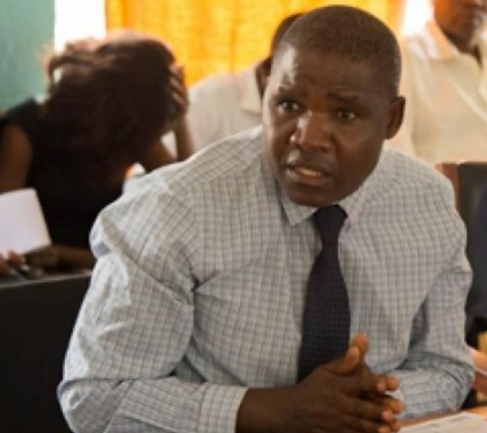 Phalombe District Commissioner Douglas Moffat addresses concerns over ink-smudged ballot papers.