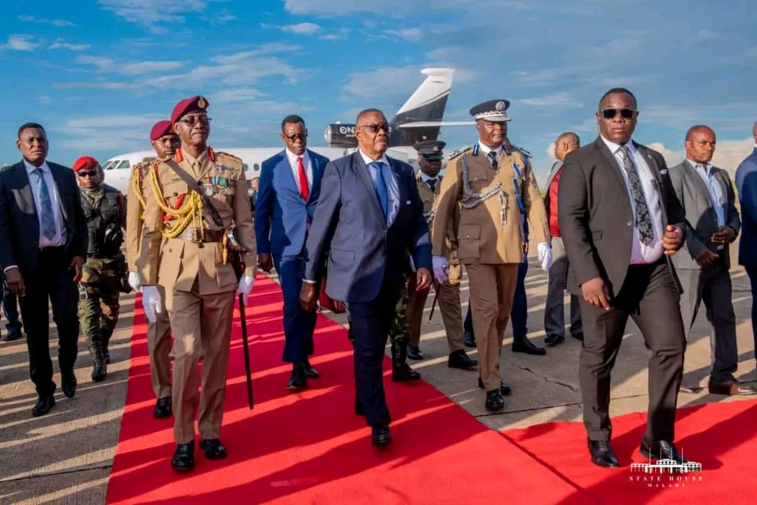 Mutharika back home after calls to cut South Africa trip short