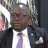 Shadreck Namalomba conveying firm governance and accountability, highlighting the news that the Malawi minister Namalomba challenges telecom firms that sued govt after failing to launch.